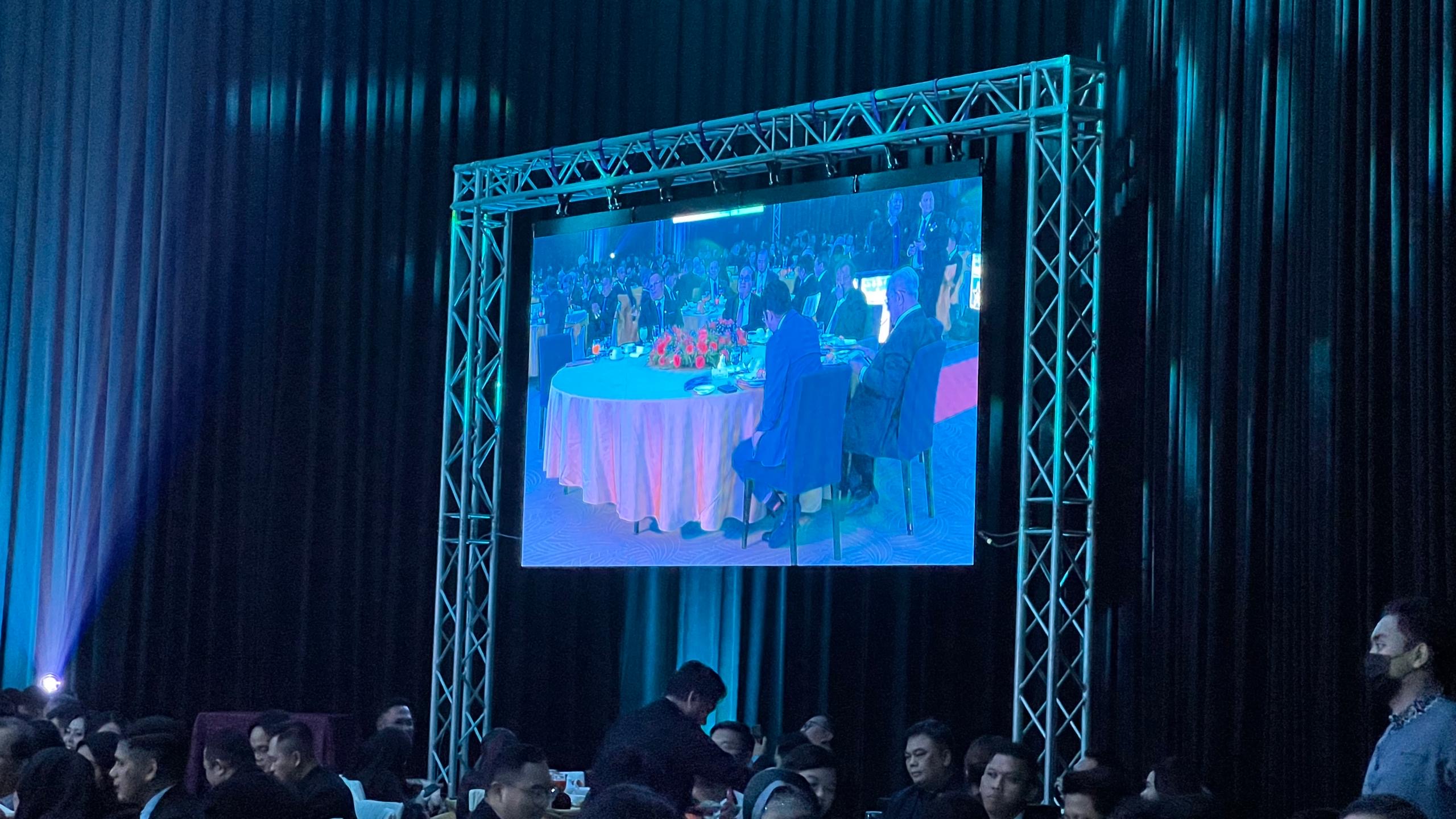Formal event with large screen